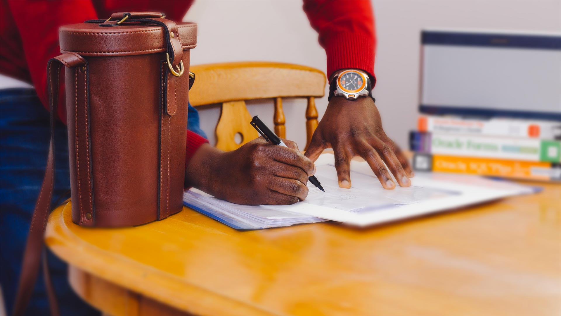 Man writing on table/studying