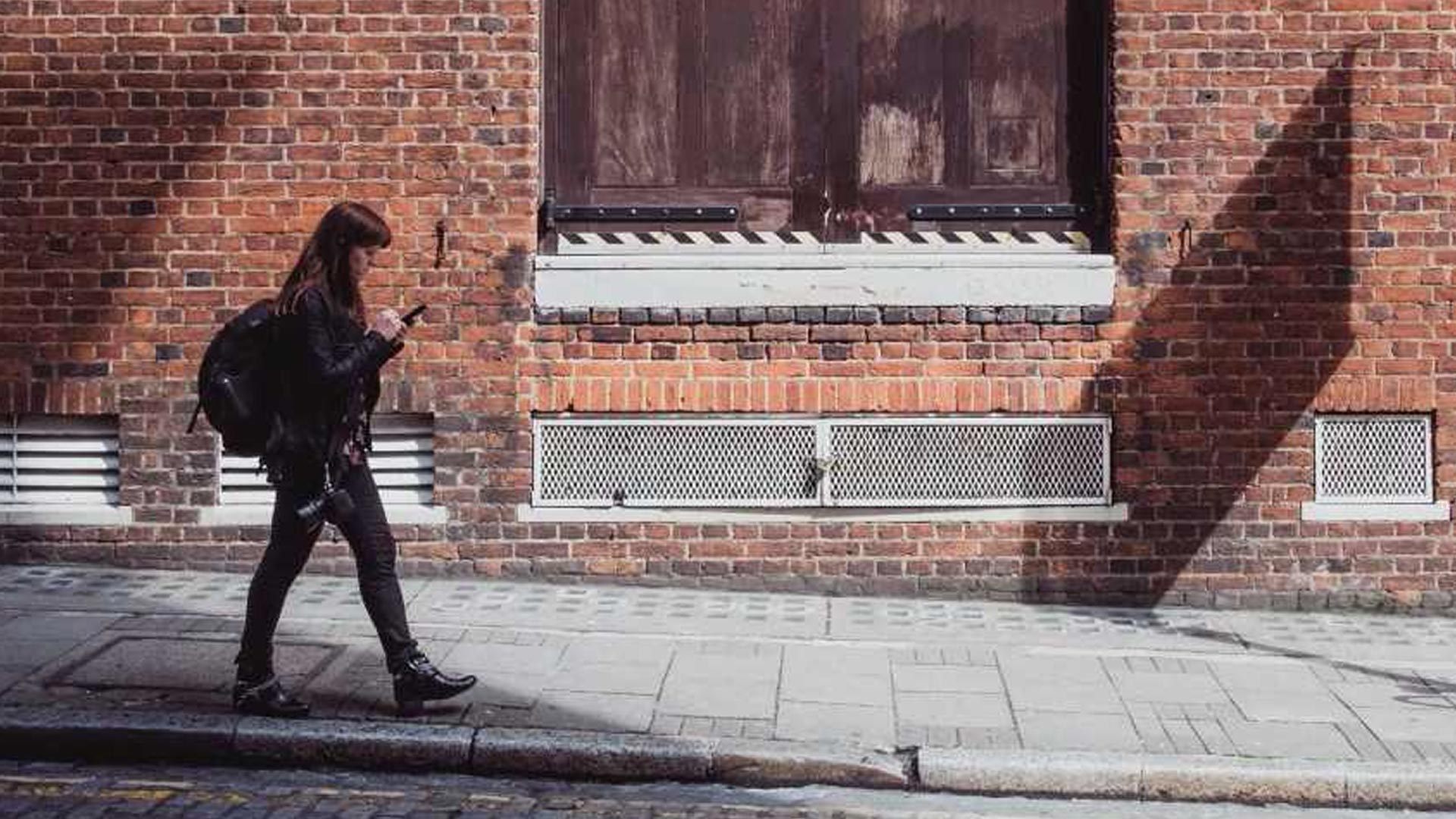 Girl walking on her phone