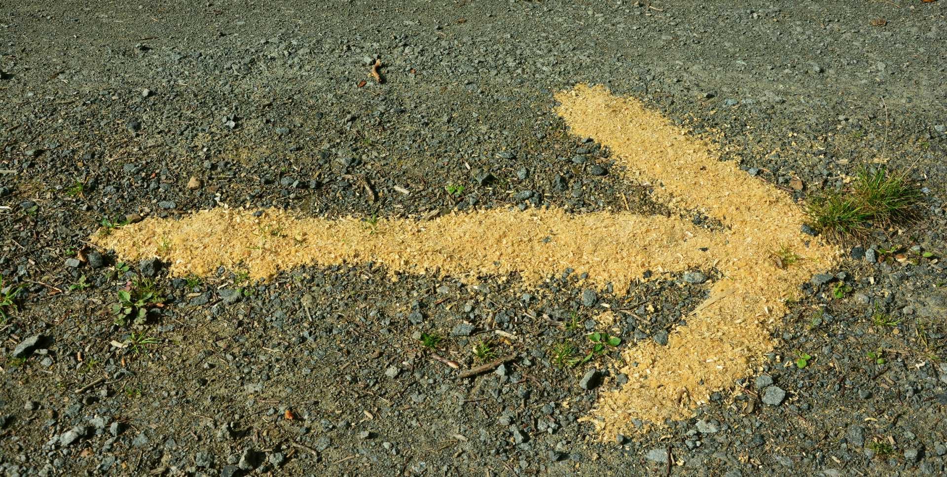 yellow arrow drawn on the road