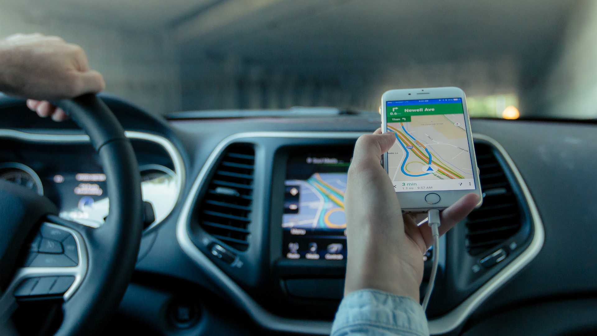 navigator in the passenger seat with GPS