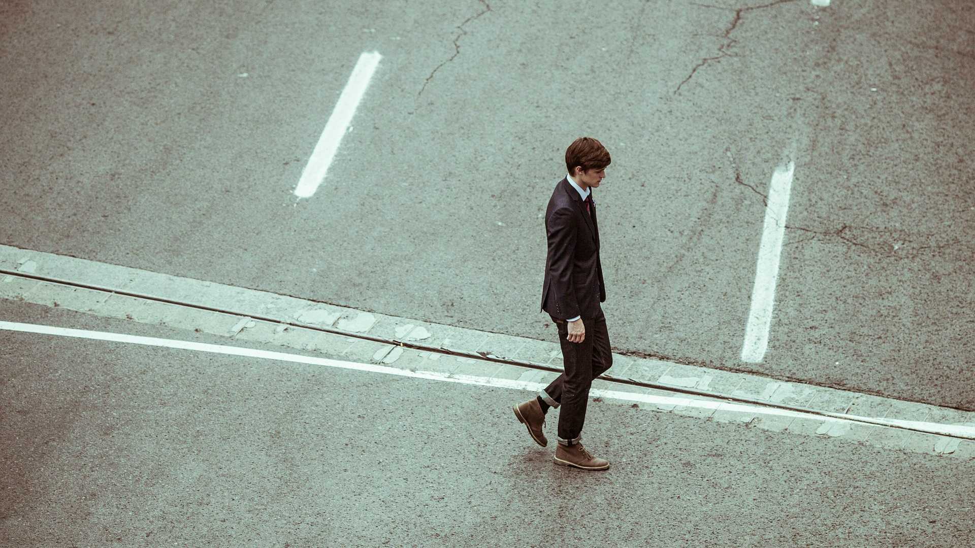 lonely businessman walking on the street