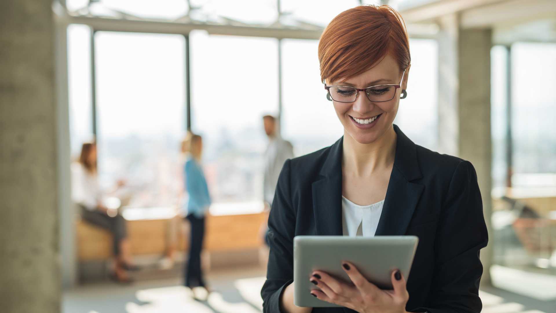 businesswoman using a tablet in an open office