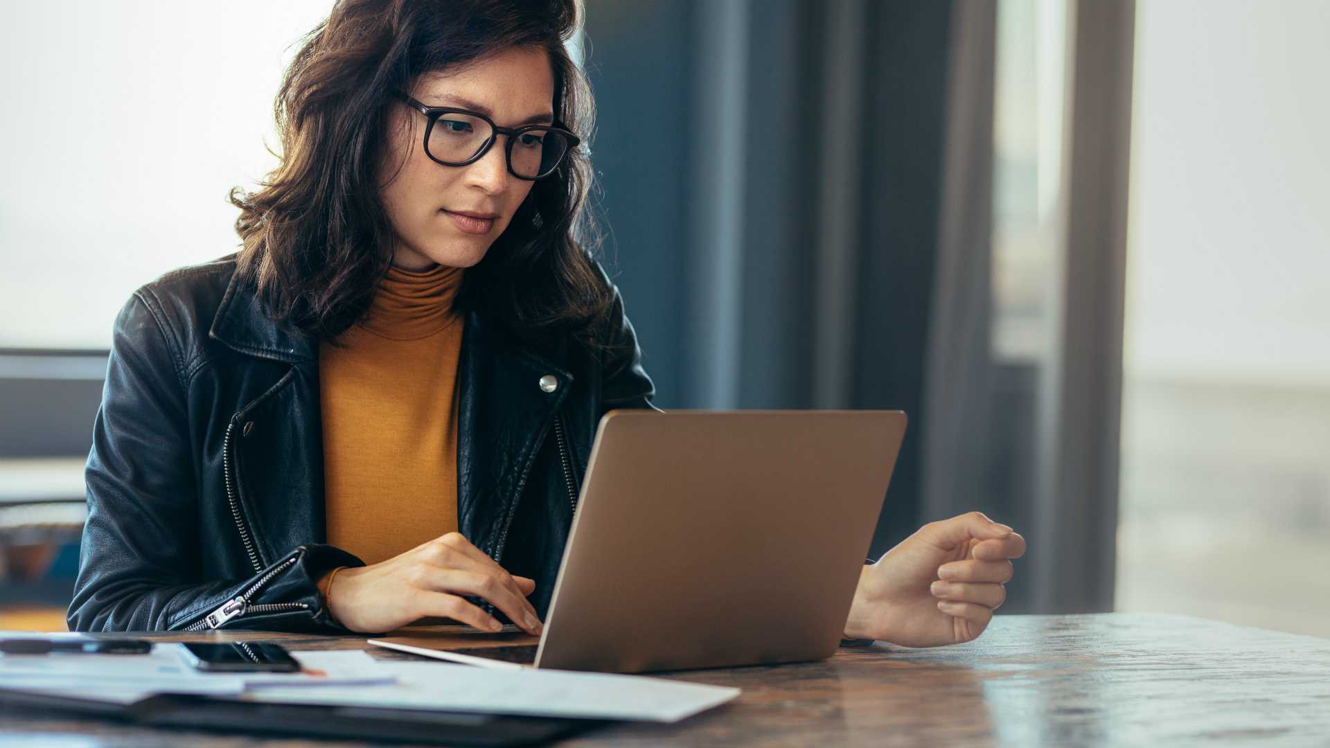 woman reading on a laptop