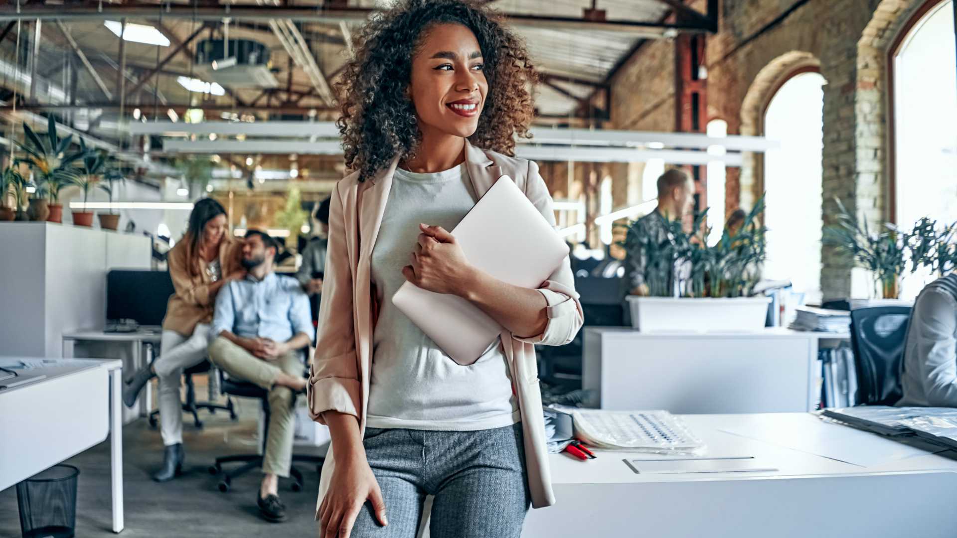 Group of young multiracial business people are working in modern office. Freelancers in coworking place. Creative and stylish youth.