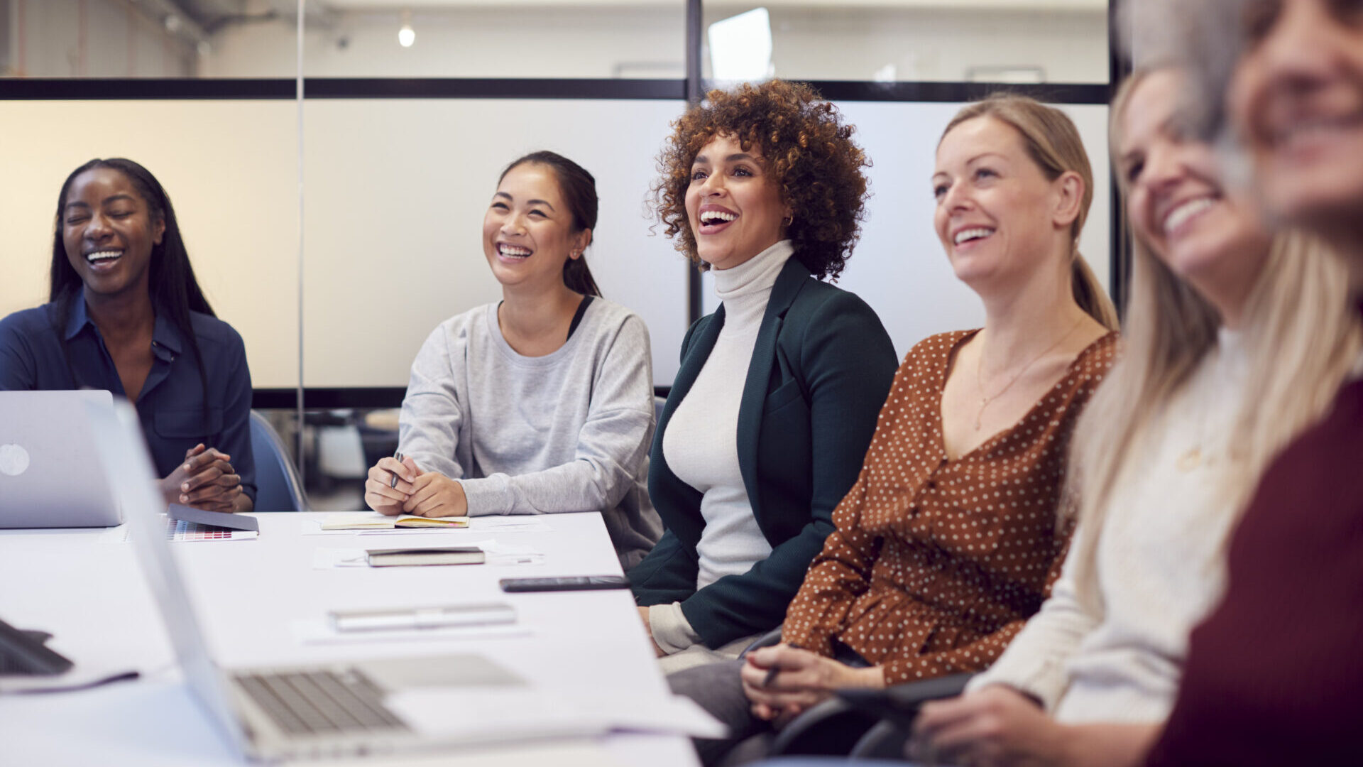 A group of businesswomen in an office setting