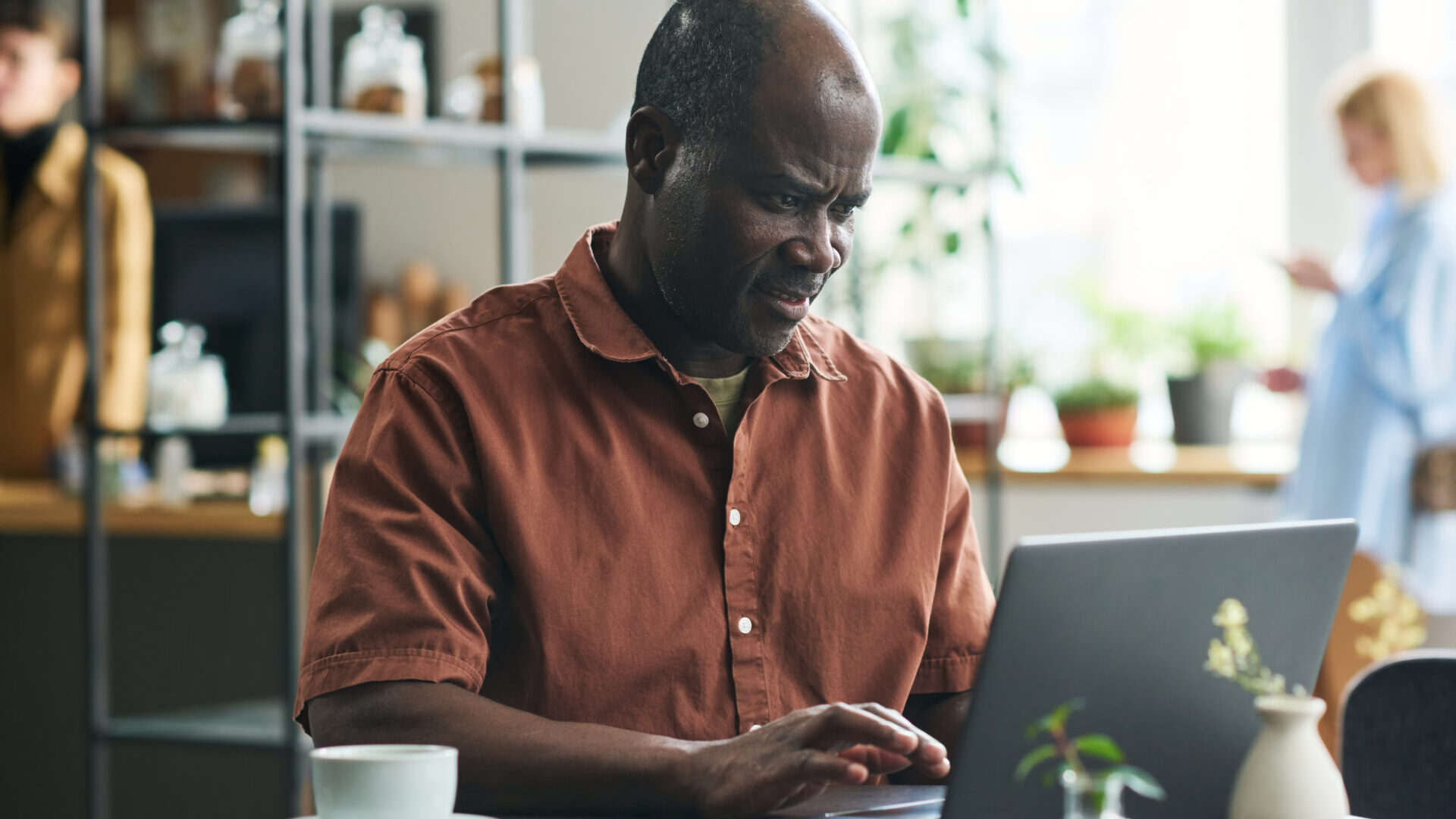 Man is looking at his personal computer