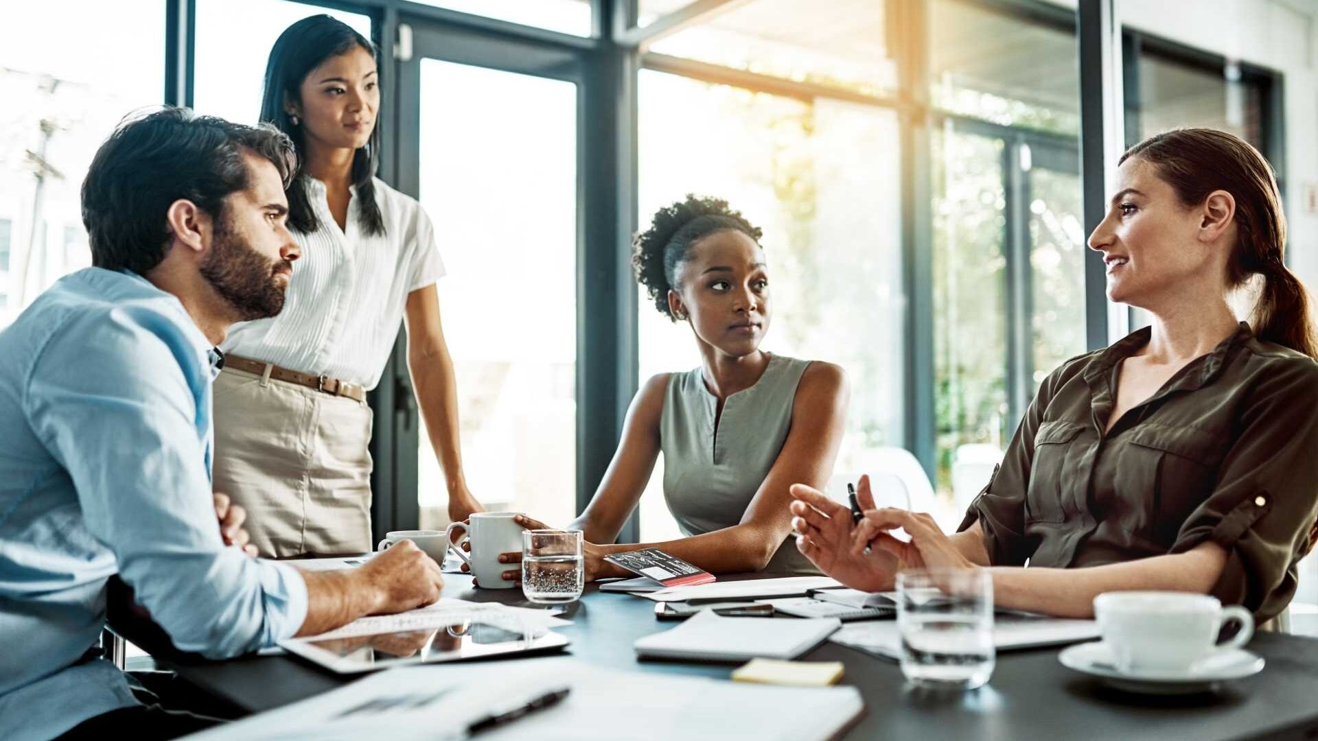 A group of professionals collaborating in an office setting