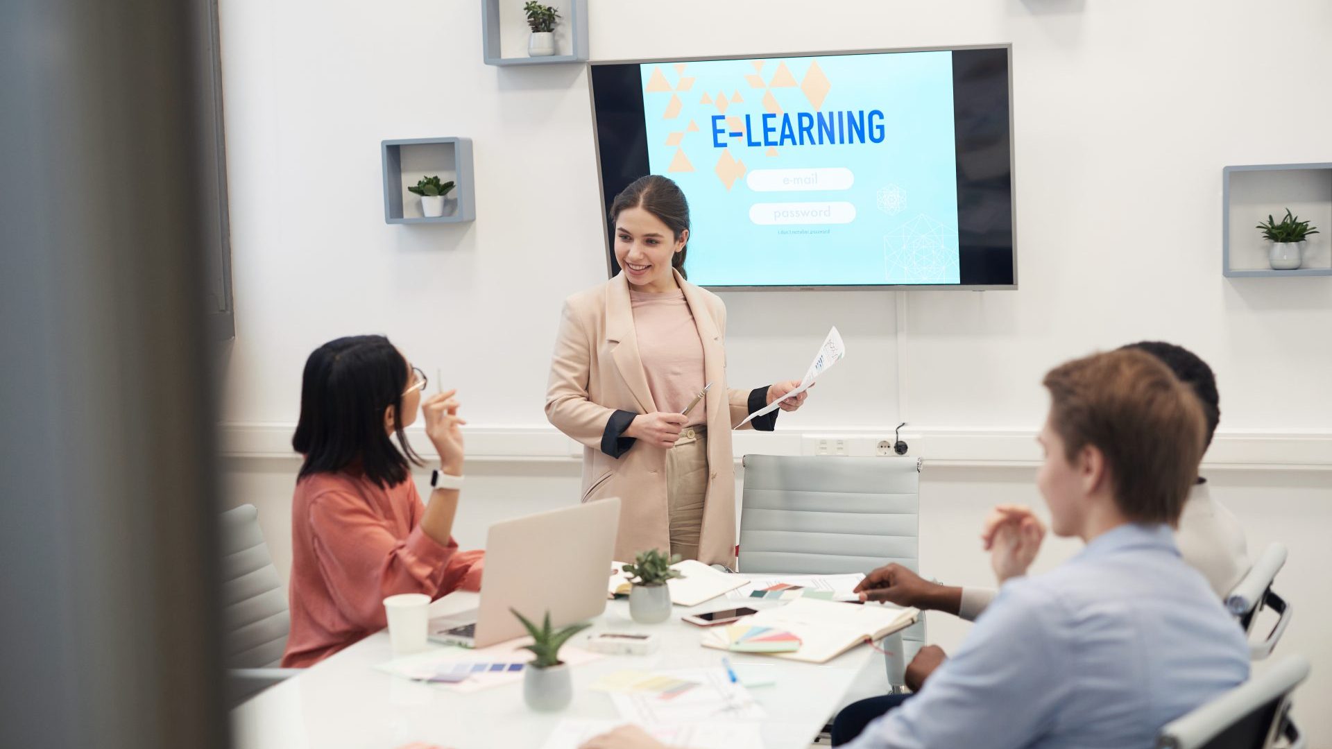 Woman showing her team a presentation.
