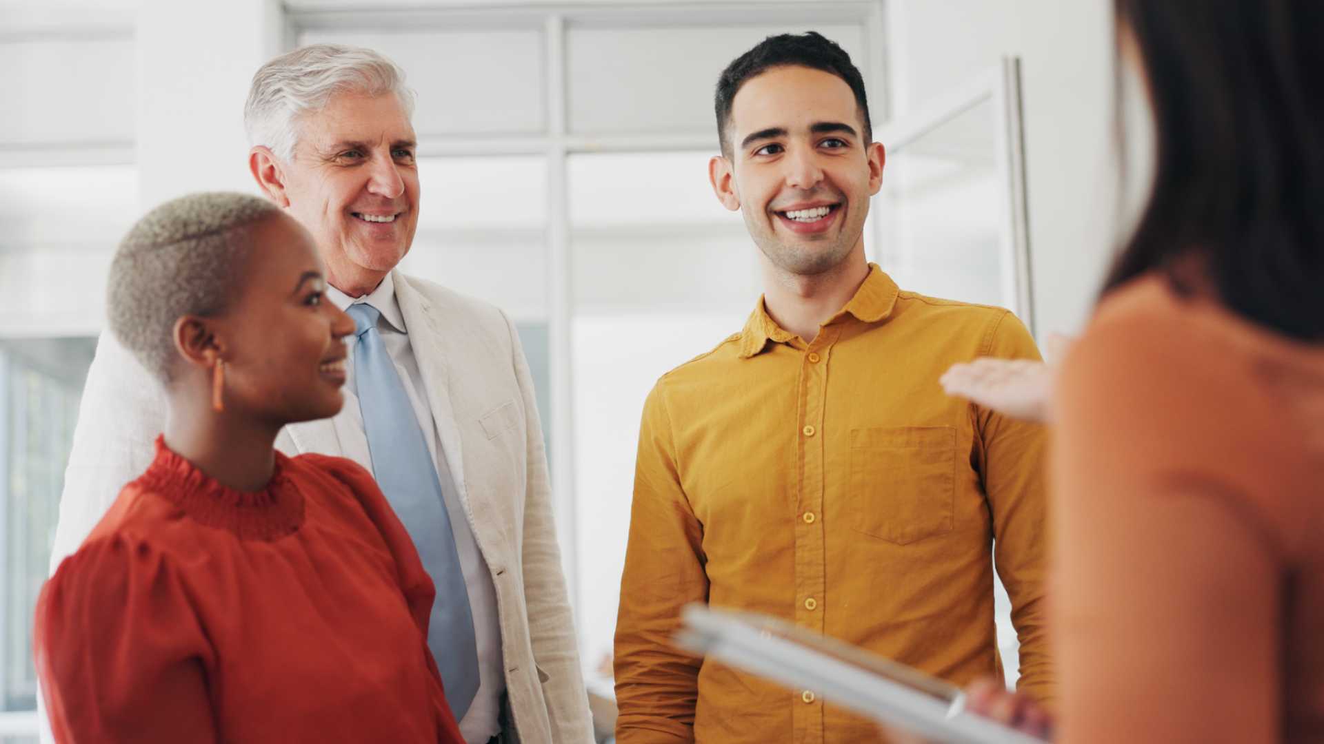 Diverse team meeting in an office setting.