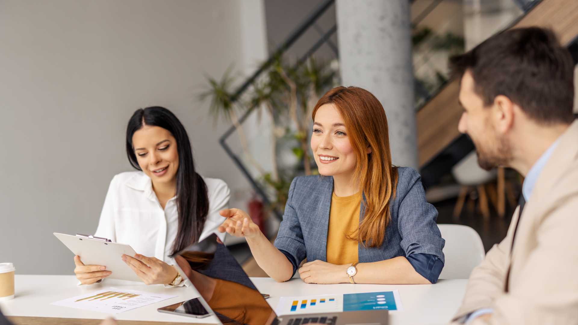 Woman in group team meeting.