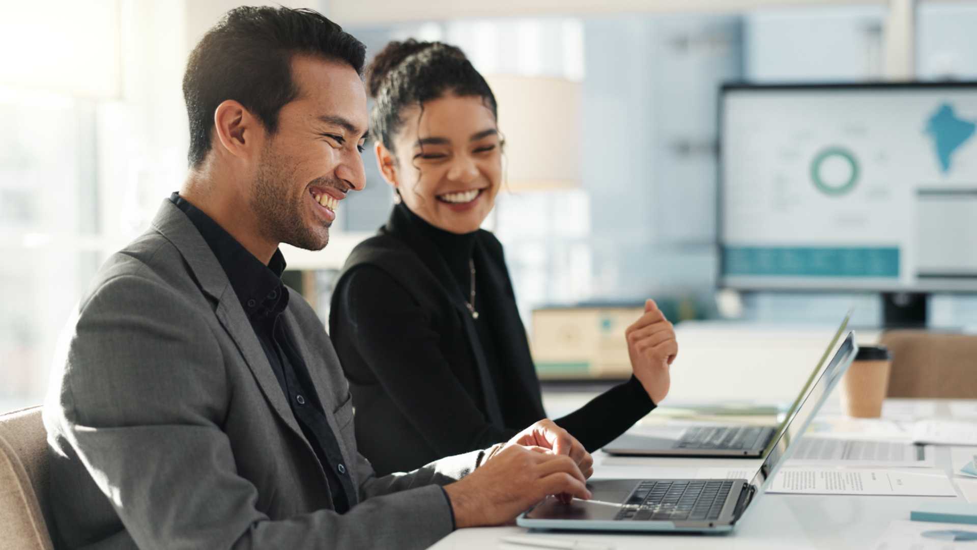 Man and woman going through training program at work.