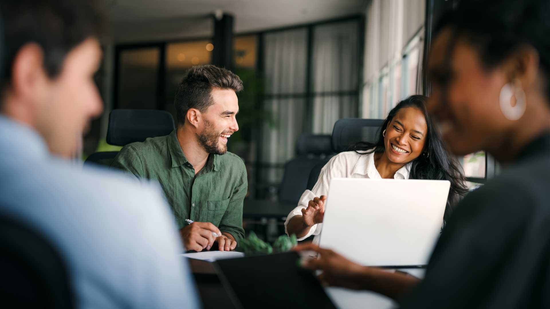 Team meeting in small setting.