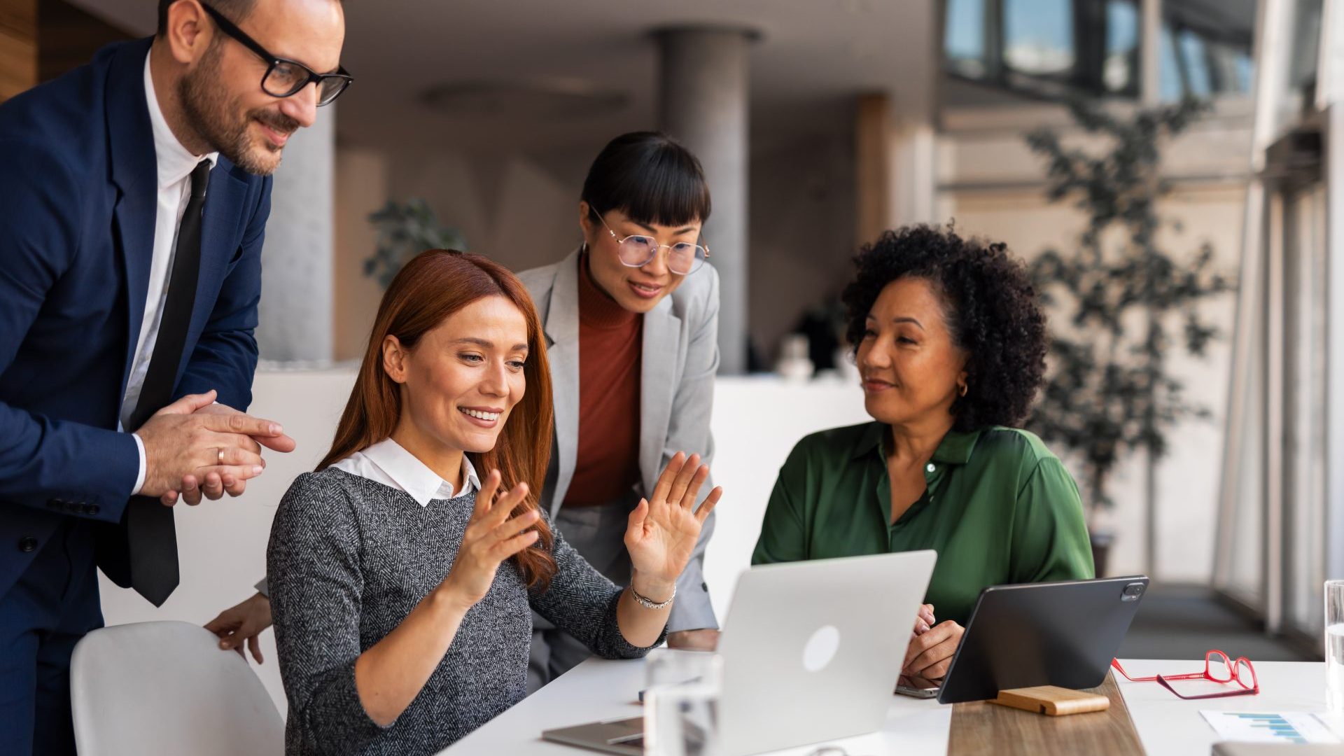 People working together in a team meeting.,